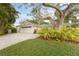 House with driveway and landscaped front yard at 4810 Bay Shore Rd, Sarasota, FL 34234