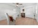 Light and airy home office features wood floors and built-in storage at 4810 Bay Shore Rd, Sarasota, FL 34234