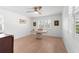 Bright home office features wood floors, built-in shelving, and plantation shutters at 4810 Bay Shore Rd, Sarasota, FL 34234
