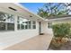 White house exterior with gray front door and tiled entryway at 4810 Bay Shore Rd, Sarasota, FL 34234