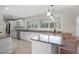 Modern kitchen with white cabinets, granite countertops and stainless steel appliances at 4810 Bay Shore Rd, Sarasota, FL 34234