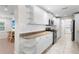 Modern kitchen with white cabinets, granite countertops, and stainless steel appliances at 4810 Bay Shore Rd, Sarasota, FL 34234