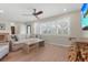 Bright living room with hardwood floors, comfy seating, and large windows at 4810 Bay Shore Rd, Sarasota, FL 34234