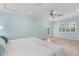 Bedroom with light blue walls, hardwood floors, and a king-size bed at 4810 Bay Shore Rd, Sarasota, FL 34234