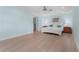 Bright bedroom with hardwood floors, king bed, and access to the outside at 4810 Bay Shore Rd, Sarasota, FL 34234