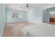 Spacious bedroom with light blue walls, hardwood floors, and a king bed at 4810 Bay Shore Rd, Sarasota, FL 34234