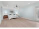 Spacious light blue bedroom with hardwood floors and a king-size bed at 4810 Bay Shore Rd, Sarasota, FL 34234
