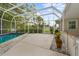 Relaxing screened-in pool with a spacious deck at 4810 Bay Shore Rd, Sarasota, FL 34234
