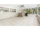 Large screened-in patio with tiled floor, wet bar, and grill at 4810 Bay Shore Rd, Sarasota, FL 34234