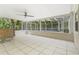 Spacious screened-in pool area with tiled flooring and wet bar at 4810 Bay Shore Rd, Sarasota, FL 34234