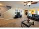 Living room with leather reclining sofa, TV, and fireplace at 4914 60Th E Dr, Bradenton, FL 34203