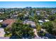 Aerial view of a single Gathering home with tropical landscaping at 5140 Windward Ave, Sarasota, FL 34242