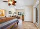 Spacious bedroom with tiled floors and access to patio at 5140 Windward Ave, Sarasota, FL 34242