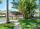 Covered boat lift with a walkway and tropical foliage at 5140 Windward Ave, Sarasota, FL 34242