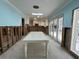 Bright dining room with white table and access to backyard at 5140 Windward Ave, Sarasota, FL 34242