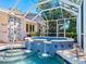 Inviting hot tub with a waterfall feature and blue tile at 5140 Windward Ave, Sarasota, FL 34242