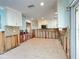 Kitchen undergoing renovation with new flooring and cabinets at 5140 Windward Ave, Sarasota, FL 34242