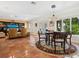 Spacious living area with tiled floors, comfortable seating, and a dining area at 5140 Windward Ave, Sarasota, FL 34242