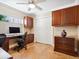 Home office with built-in cabinetry and hardwood floors at 5140 Windward Ave, Sarasota, FL 34242