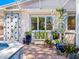 Outdoor shower with tile accents and lush landscaping at 5140 Windward Ave, Sarasota, FL 34242