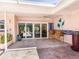 Relaxing patio with seating and access to the pool area at 5140 Windward Ave, Sarasota, FL 34242