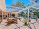 Outdoor patio with pool, spa, and wicker furniture at 5140 Windward Ave, Sarasota, FL 34242