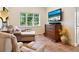 Relaxing sitting area featuring comfortable seating and a large-screen TV at 5140 Windward Ave, Sarasota, FL 34242