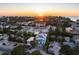 Aerial view of a two-story house near the beach at sunset at 518 Spring Ave, Anna Maria, FL 34216