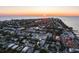 Aerial view of a charming two-story house at sunset near the water at 518 Spring Ave, Anna Maria, FL 34216