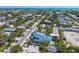 Aerial view of a two-story house near the beach with a pool at 518 Spring Ave, Anna Maria, FL 34216
