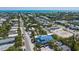 Aerial view of a two-story house near the beach with a pool at 518 Spring Ave, Anna Maria, FL 34216