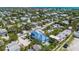 Aerial view of a two-story house near the beach with a pool at 518 Spring Ave, Anna Maria, FL 34216