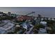 Aerial view of a stunning waterfront home with a private pool and lush landscaping at 518 Spring Ave, Anna Maria, FL 34216