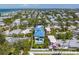 Aerial view of a two-story house near the beach with a pool at 518 Spring Ave, Anna Maria, FL 34216