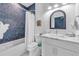 Bathroom with a tub and shower, and modern vanity at 518 Spring Ave, Anna Maria, FL 34216