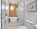 Spa-like bathroom with a freestanding soaking tub and walk-in shower at 518 Spring Ave, Anna Maria, FL 34216