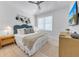 Serene bedroom with a king-size bed and coastal-inspired decor at 518 Spring Ave, Anna Maria, FL 34216