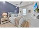 Bedroom with a king-size bed, nightstand, and TV at 518 Spring Ave, Anna Maria, FL 34216