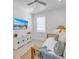 Bright bedroom with daybed, TV, and coastal decor at 518 Spring Ave, Anna Maria, FL 34216