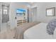 Bedroom with a queen bed, dresser, and ensuite bathroom at 518 Spring Ave, Anna Maria, FL 34216