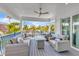 Relaxing outdoor deck with seating area and ocean views at 518 Spring Ave, Anna Maria, FL 34216