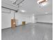 Spacious two-car garage with epoxy flooring and abundant storage at 518 Spring Ave, Anna Maria, FL 34216