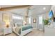 Spacious main bedroom with a four-poster bed and stylish decor at 518 Spring Ave, Anna Maria, FL 34216