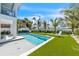 Luxury pool and putting green with artificial turf at 518 Spring Ave, Anna Maria, FL 34216