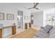 Bright upper level landing with built-in shelves and a cozy sitting area at 518 Spring Ave, Anna Maria, FL 34216