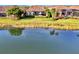 Aerial view of house with pool and lake view at 5401 Manchini St, Sarasota, FL 34238