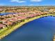 Aerial view of neighborhood with lake at 5401 Manchini St, Sarasota, FL 34238