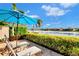 Relaxing patio with lounge chairs and lake view at 5401 Manchini St, Sarasota, FL 34238
