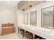 Elegant bathroom with three sinks and modern fixtures at 5401 Manchini St, Sarasota, FL 34238