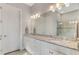 Bright bathroom features double sinks, granite countertops, and white cabinets at 5401 Manchini St, Sarasota, FL 34238